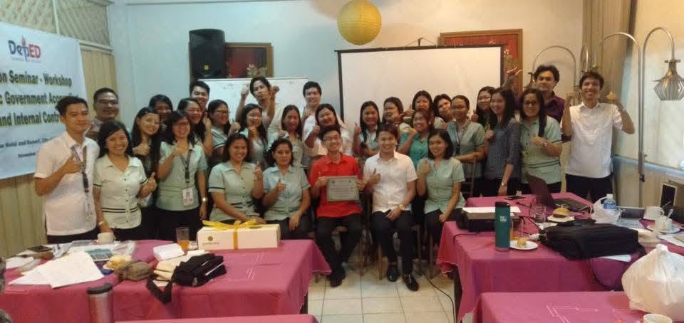 Group photo of DepEd teacher-participants with Jayson at the close of the bookkeeping seminar