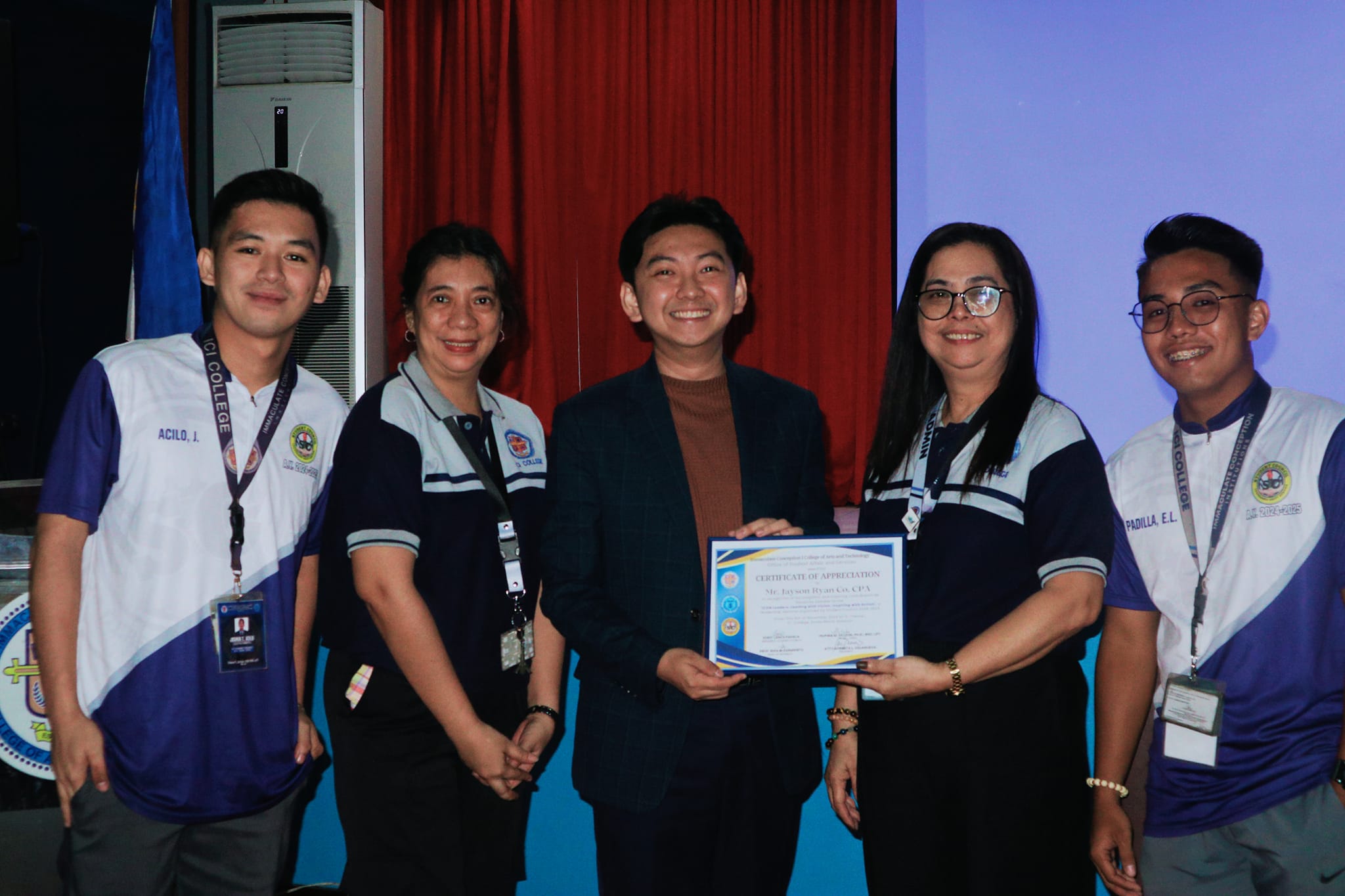 Jayson Ryan Co receiving a Certificate of Appreciation from ICI College faculty and students after the leadership seminar